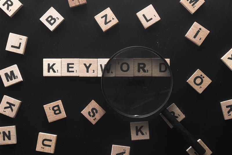 keyword-written-wooden-letters-with-magnifying-glass-keyword-research-concept